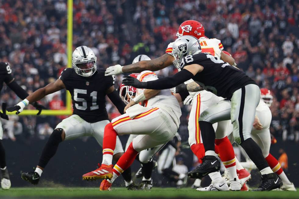 Las Vegas Raiders defensive end Maxx Crosby (98) sacks Kansas City Chiefs quarterback Patrick M ...