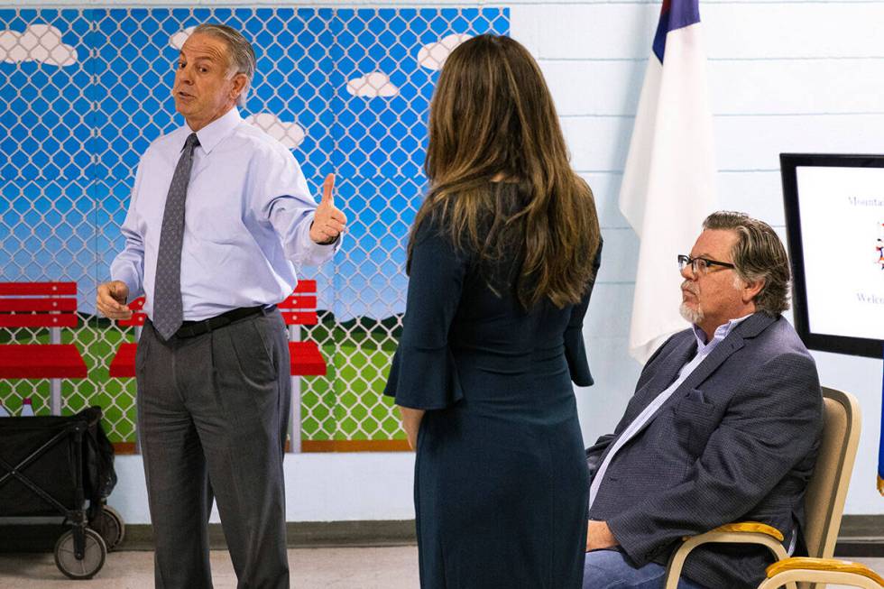 Gov. Joe Lombardo, left, gestures toward Valeria Gurr, Nevada School Choice Coalition, as Raymo ...