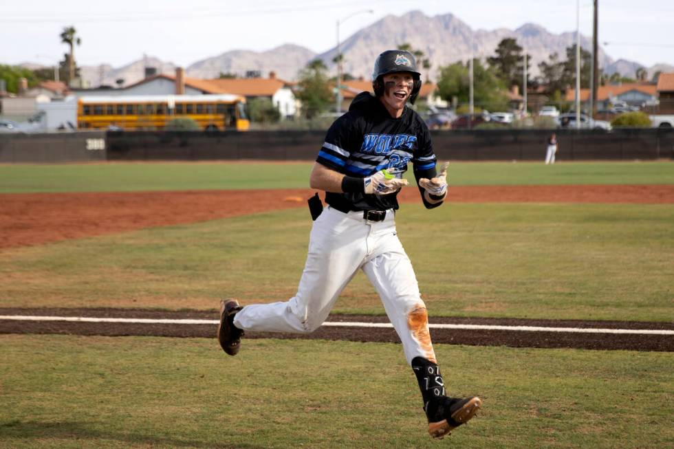 Basic’s Andruw Giles celebrates after hitting a homer during a high school Class 5A Sout ...