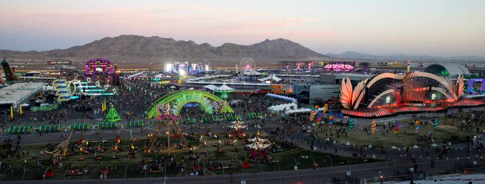Attendees of the Electric Daisy Carnival file in as the sun sets over the Las Vegas Motor Speed ...