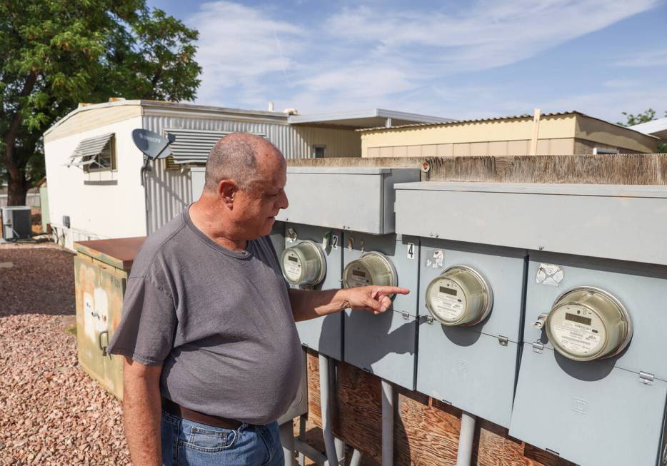 Anthony Smith points out the electric meter for his mobile home at the Sandhill Valley Communit ...