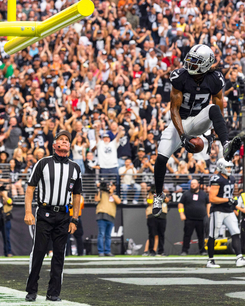 Las Vegas Raiders wide receiver Davante Adams (17) celebrates after scoring a touchdown against ...