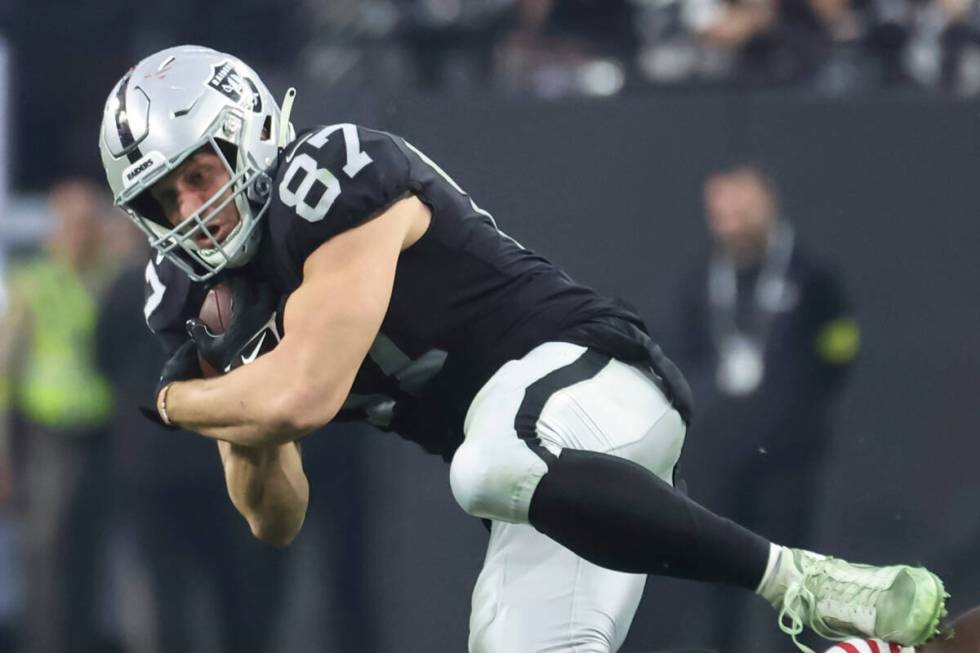 Raiders tight end Foster Moreau (87) gets tripped up by San Francisco 49ers cornerback Deommodo ...