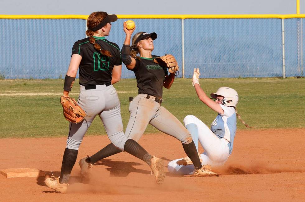 Palo Verde's Taylor Johns (11) throws a ball as Centennial's Ashley Madonia (3) slide into seco ...