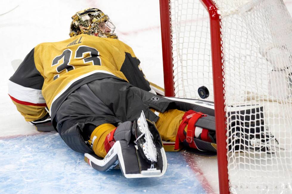 Golden Knights goaltender Adin Hill (33) misses the save on a goal shot by Edmonton Oilers cent ...