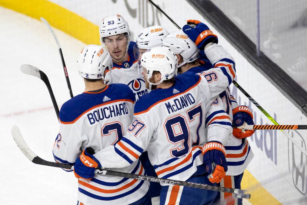 The Edmonton Oilers celebrate after left wing Zach Hyman (18) scored during the first period in ...