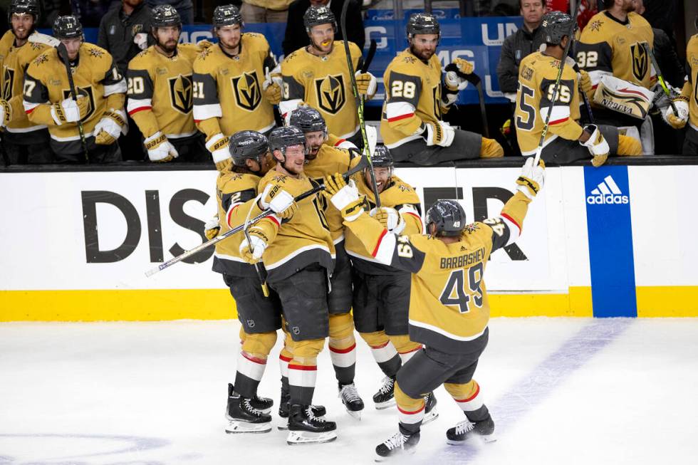 The Golden Knights celebrate after defenseman Nicolas Hague (14) scored during the second perio ...