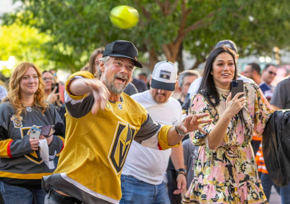 Actor Josh Duhamel throws a dunk-tank ball at an Edmonton Oilers dressed subject before facing ...