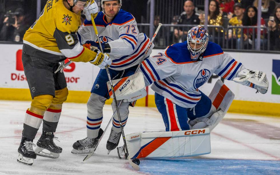 Golden Knights center Jack Eichel (9) readies to score past Edmonton Oilers center Nick Bjugsta ...