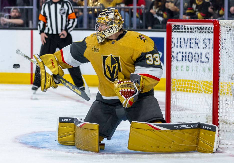 Golden Knights goaltender Adin Hill (33) deflects a Edmonton Oilers shot during the second peri ...