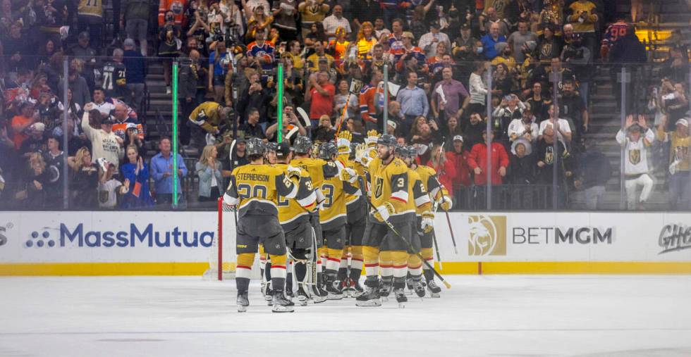 Golden Knights players celebrate their 4-3 win over the Edmonton Oilers following the third per ...