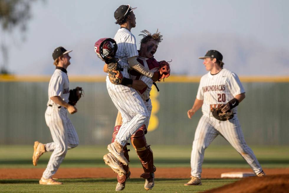 Desert Oasis outfielder Connor Jacob, center left, and catcher Jake Cook, center right, celebra ...