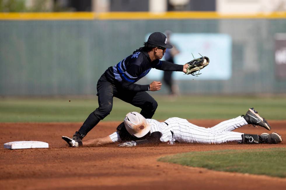 Desert Oasis’ Joell Castro slides into second base while Basic’s Ty Southisene ca ...