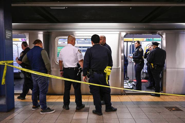 New York police officers respond to the scene where a fight was reported on a subway train, Mon ...