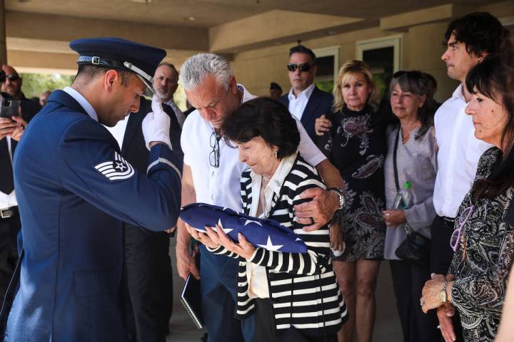 An Air Force member presents a flag to the late Air Force Col. James Abraham’s wife, Jo ...