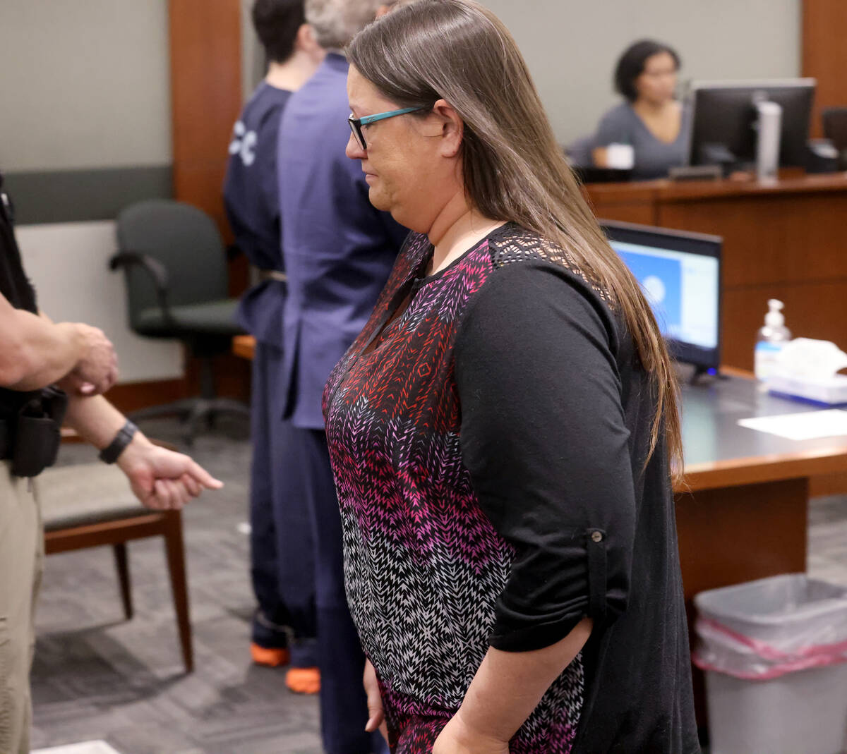 Jamie Burman, daughter of Kevin Hackett, walks back to her seat after reading a victim impact s ...