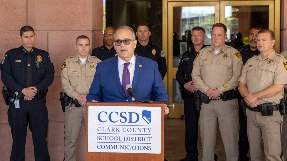 Clark County School District Superintendent Dr. Jesus Jara speaks from the podium with CCSD Pol ...