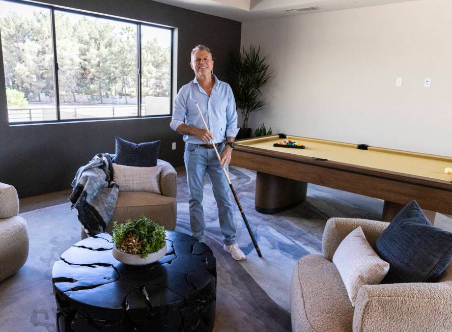Chris Beucler, president of Blue Heron Nexus, poses for a photo at the newly finished house at ...