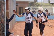 Spring Valley's Carlee Melton (14) and Spring Valley's Isabella Lenahan (15) celebrate after sc ...