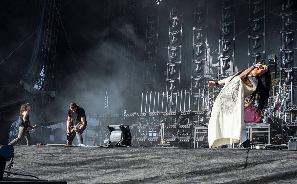 Evanescence lead singer Amy Lee, right, performs with the band during the Sick New World festiv ...