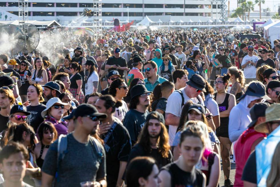 Attendees walk between the four stages during the Sick New World festival at the Las Vegas Fest ...