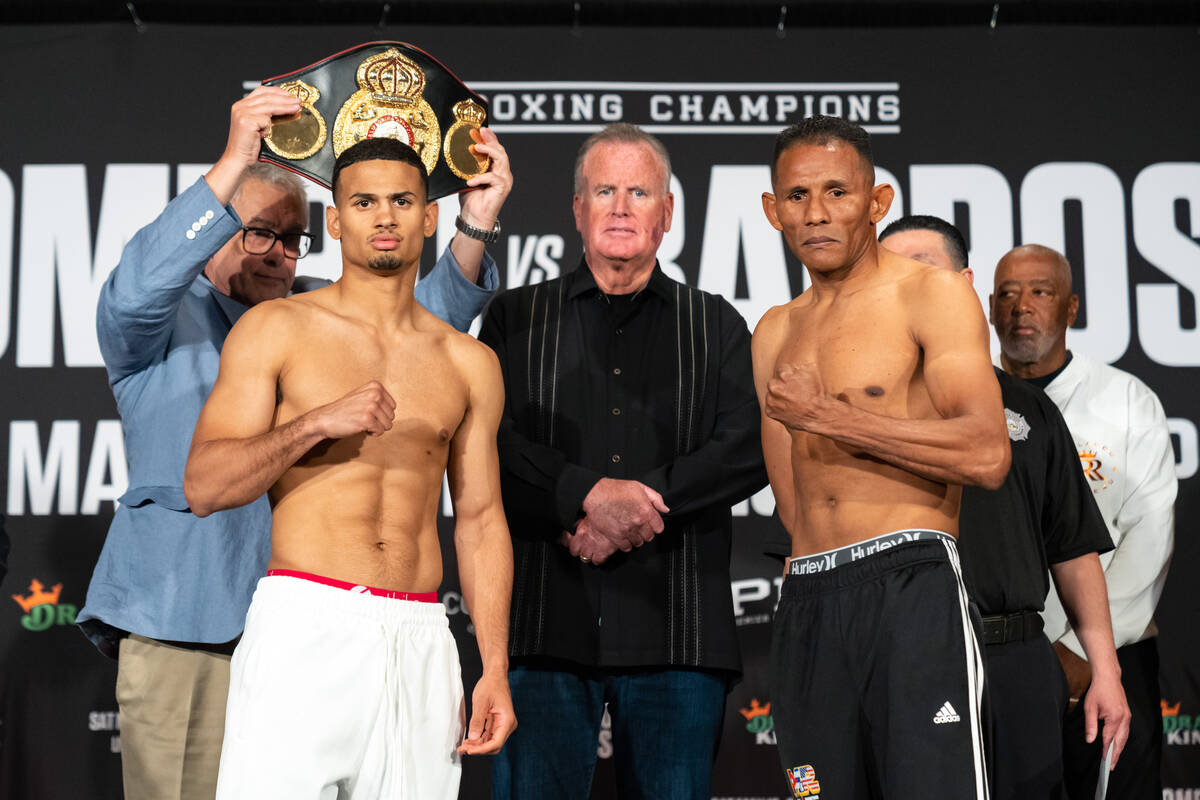 Rolando Romero (left) and Ismael Barroso (right) pose after weighing in for their WBA junior we ...