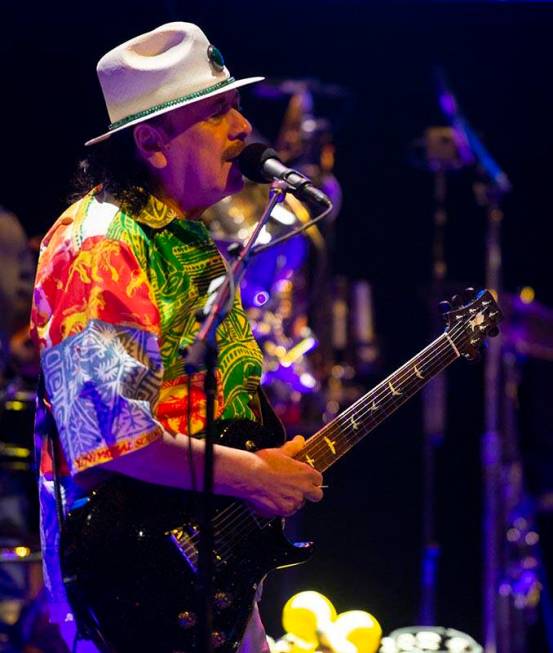 Carlos Santana performs a sound check after a press conference to announce an extension of Sant ...