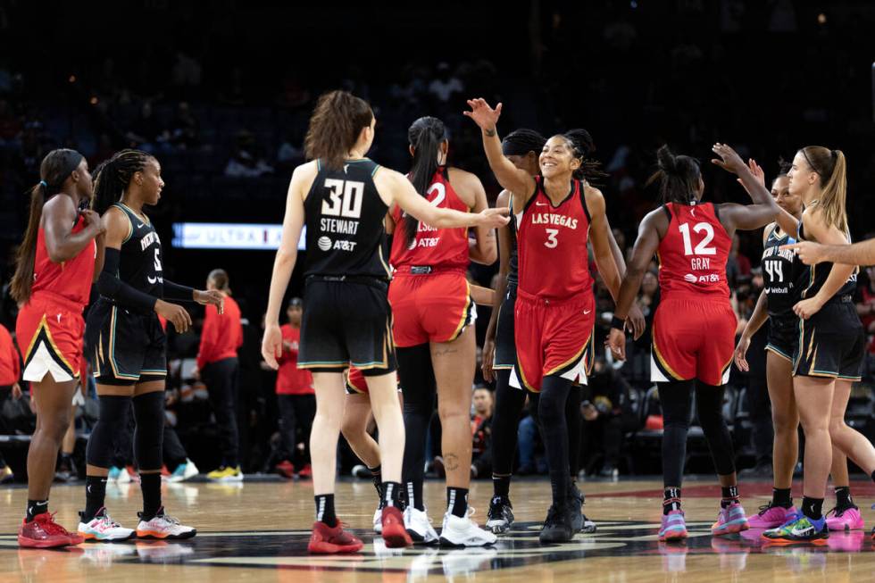 The Las Vegas Aces and the New York Liberty greet each other before a WNBA preseason basketball ...