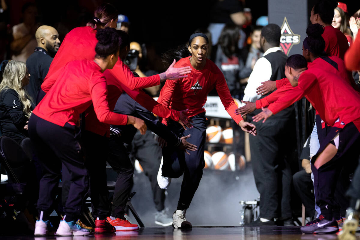 Aces forward A'ja Wilson (22) runs onto the court as she is announced in the starting lineup be ...