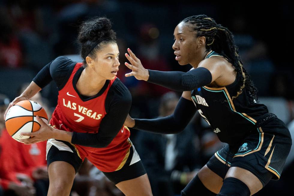 Aces forward Alysha Clark (7) looks to pass while New York Liberty guard Kaila Charles (5) defe ...