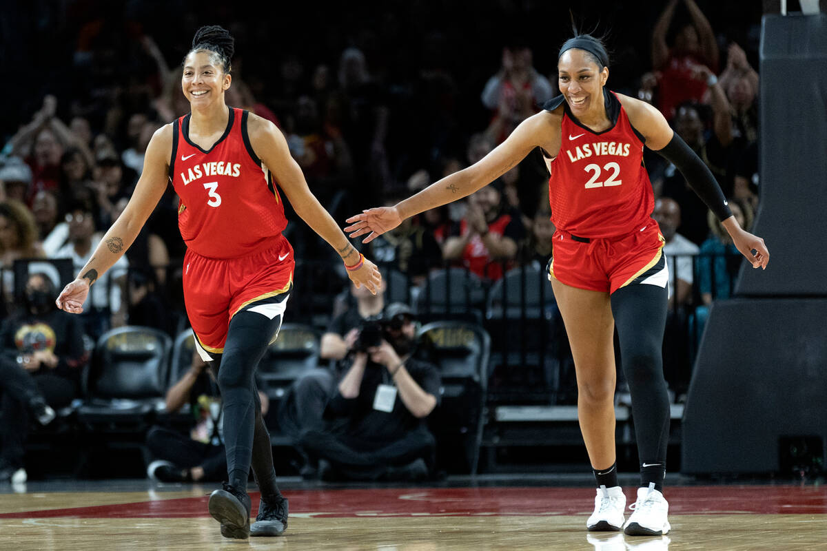 Aces forward Candace Parker (3) and Aces forward A'ja Wilson (22) slap hands after Parker score ...