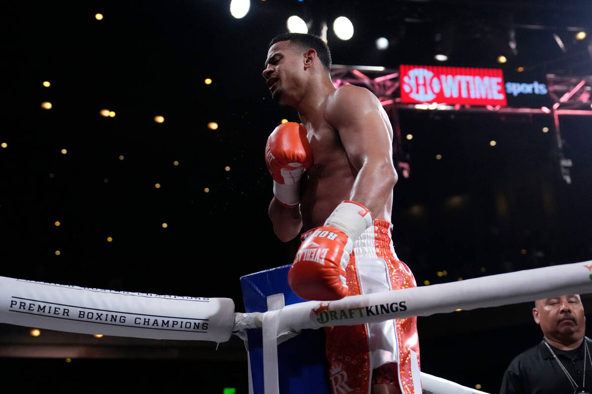 Rolando Romero celebrates after defeating Ismael Barroso in a super lightweight title boxing ma ...