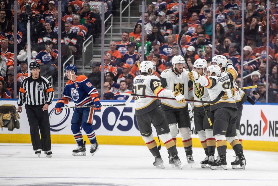 Vegas Golden Knights celebrate a goal by Knights right wing Jonathan Marchessault (81) as Edmon ...