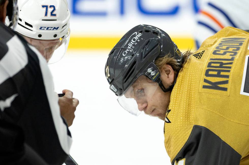 Golden Knights center William Karlsson (71) faces off against Edmonton Oilers center Nick Bjugs ...