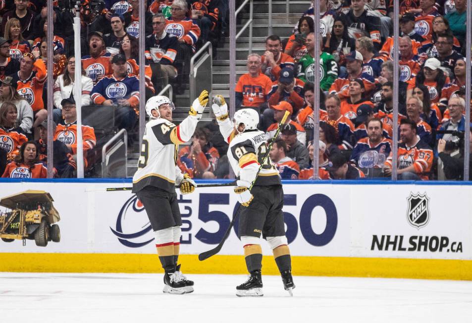 Golden Knights forwards Ivan Barbashev (49) and Jonathan Marchessault (81) celebrate Marchessau ...