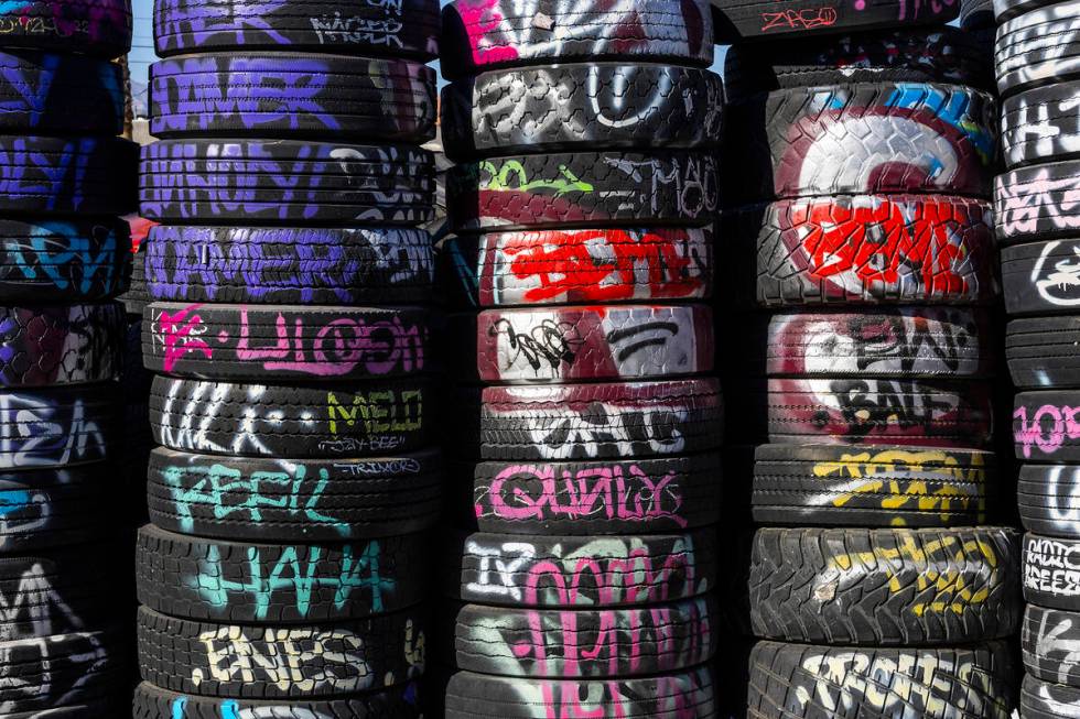 Stacked tires with graffiti in an alley in the Arts District on Friday, March 17, 2023, in Las ...