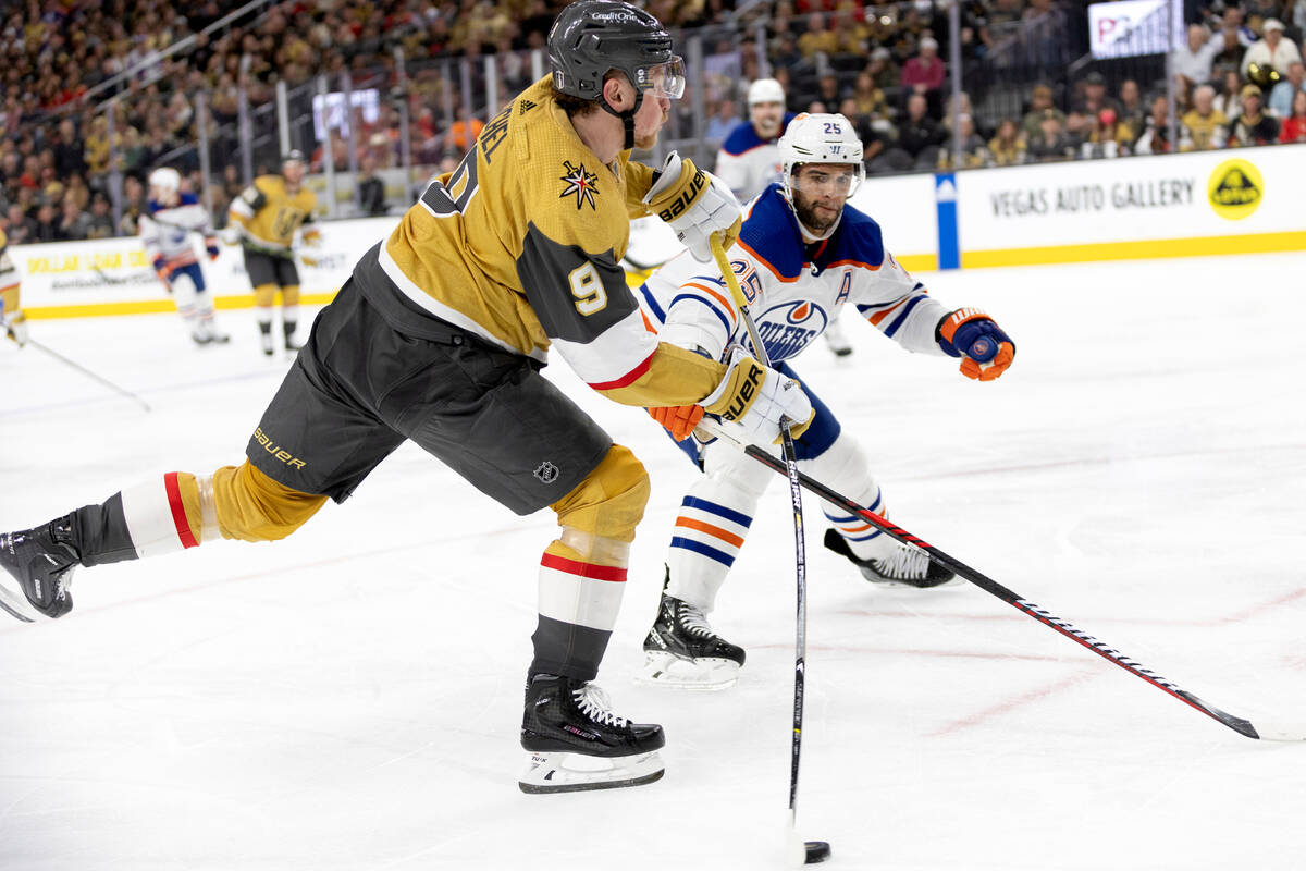 Golden Knights center Jack Eichel (9) shoots against Edmonton Oilers defenseman Darnell Nurse ( ...