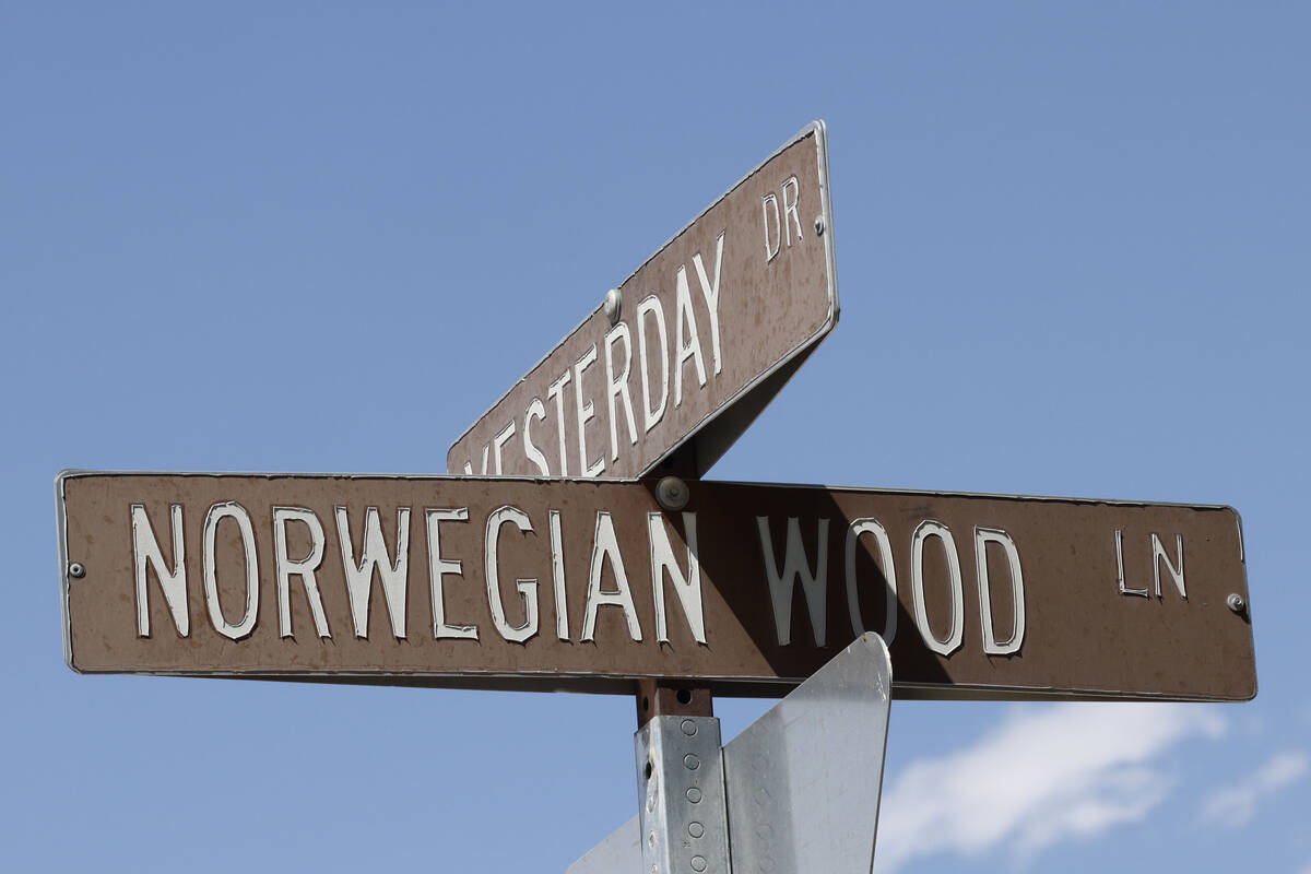 Street signs for Yesterday Drive and Norwegian Wood Lane are seen, Wednesday, May 24, 2023, in ...