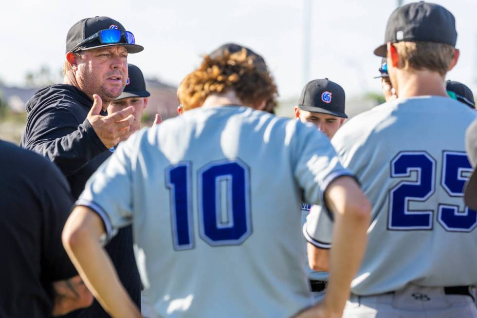 Bishop Gorman coach Chris Sheff counsels his players after beating Centennial 4-3 players durin ...