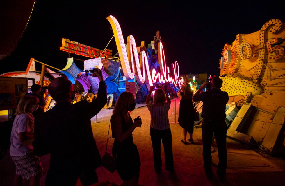 People take photos as the Moulin Rouge sign iat the Neon Museum in Las Vegas. (Chase Stevens/La ...