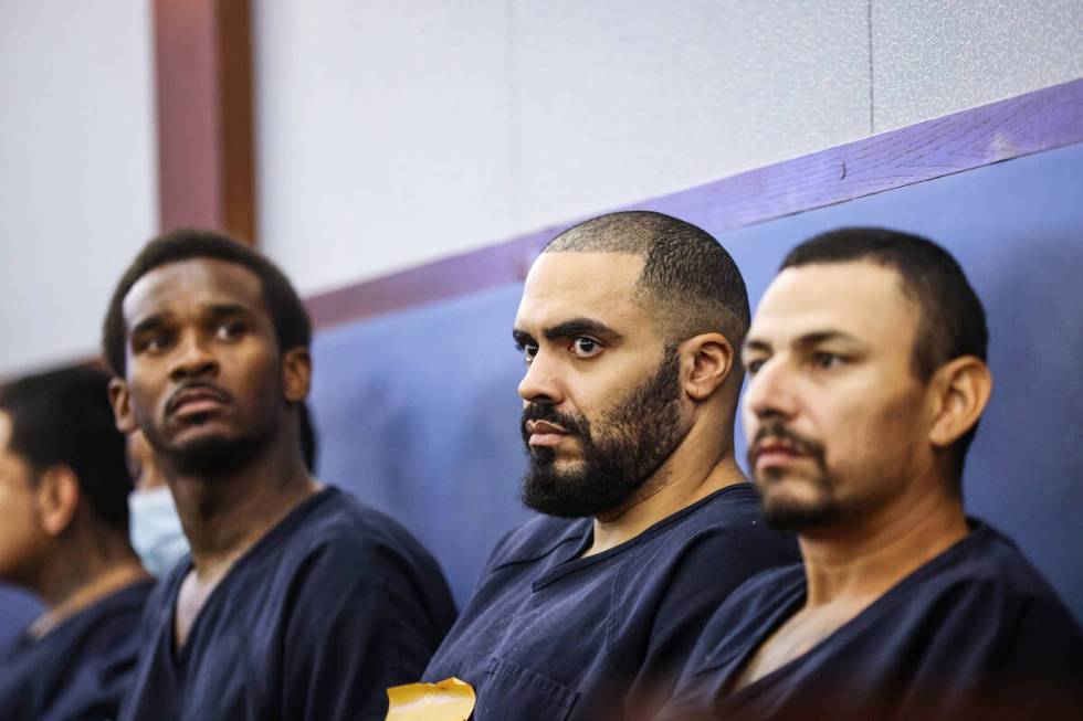 Justin Carter, center, appears at a hearing where he is facing charges for allegedly kidnapping ...