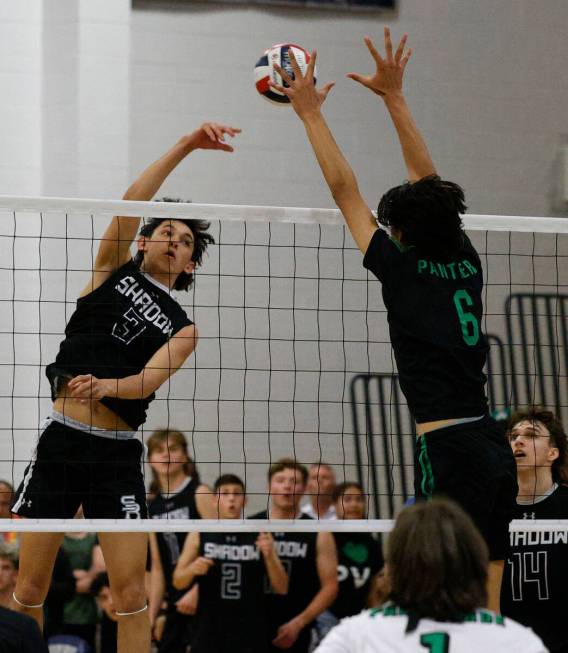 Shadow Ridge's Caleb Fisher (3) spikes the ball against Palo Verde's Carmine (Tama) Smeltzer (6 ...