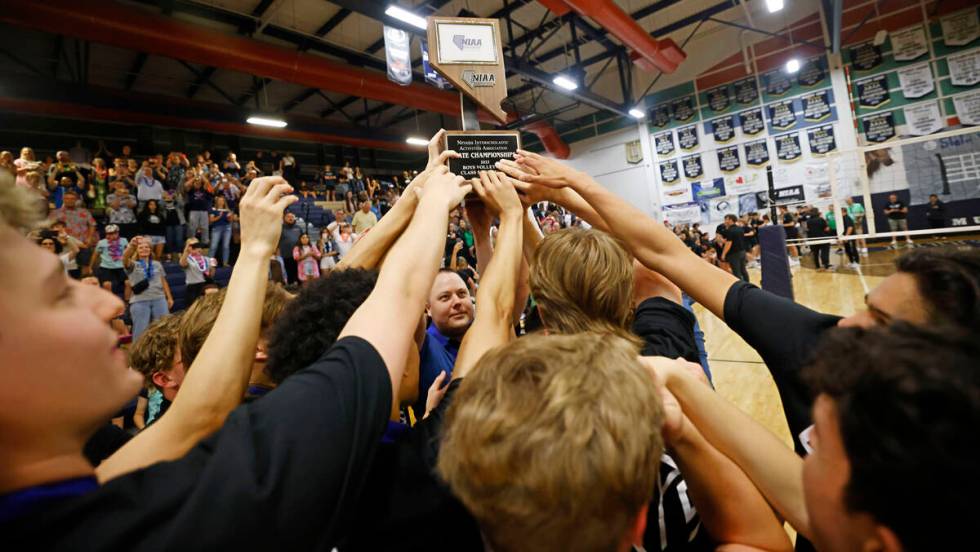 Shadow Ridge’s players hold up the trophy to celebrate their victory against Palo Verde ...