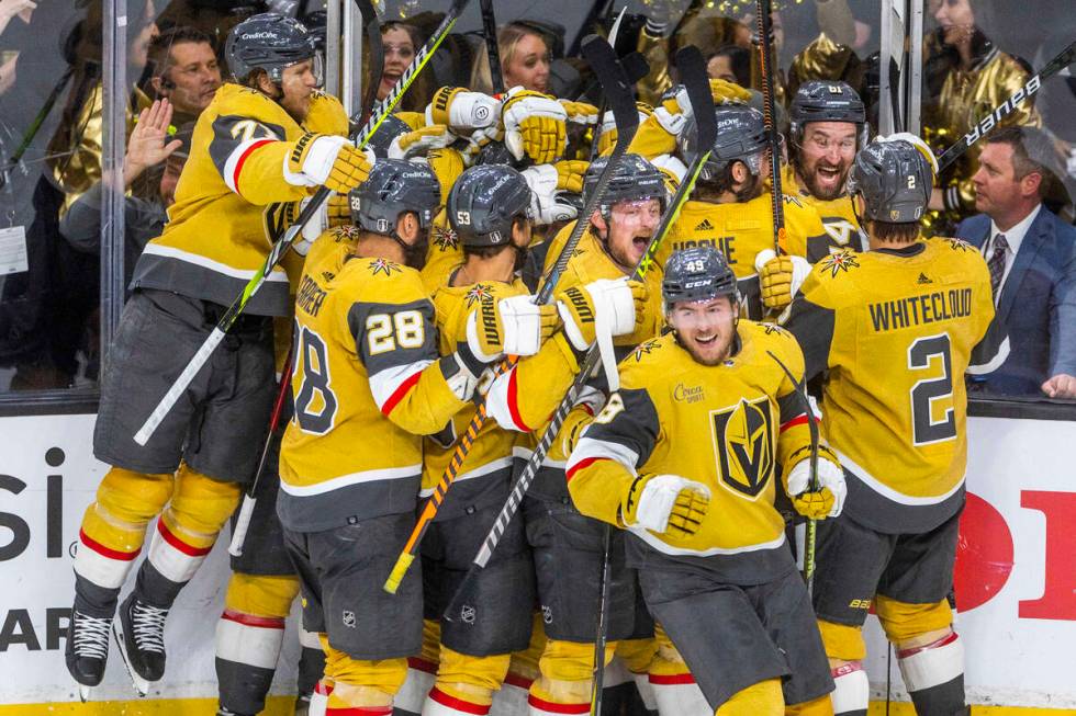 Golden Knights teammates celebrate center Brett Howden (21) for a score against the Dallas Star ...