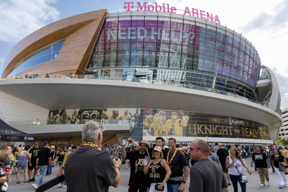 Fans pose for photos before Game 1 of the Western Conference Final playoff series between the G ...