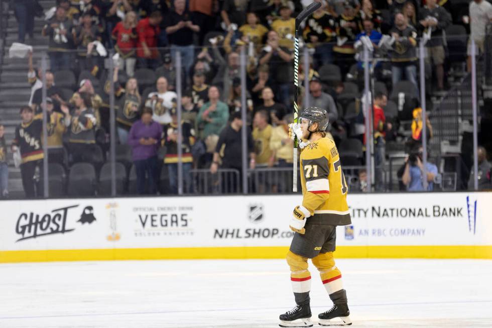 Golden Knights center William Karlsson (71) holds his stick in the air after his team won in ov ...