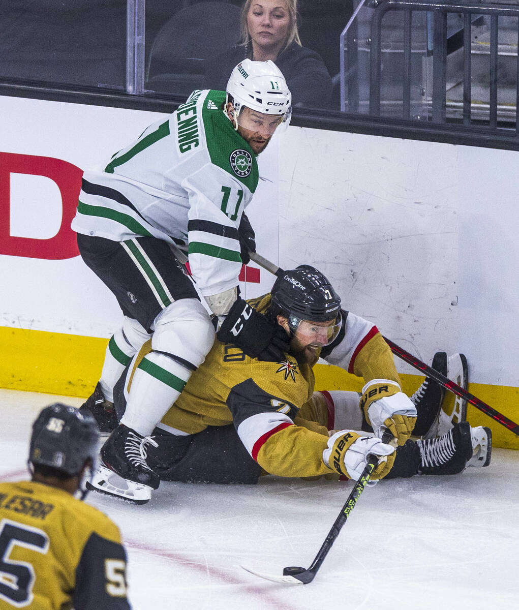 Golden Knights defenseman Alex Pietrangelo (7) still controls the puck after being pushed down ...