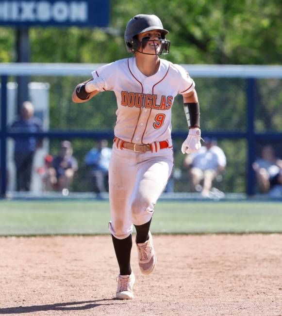 Douglas High's Haley Wilkinson reacts as she runs the base after hitting a solo homer against P ...