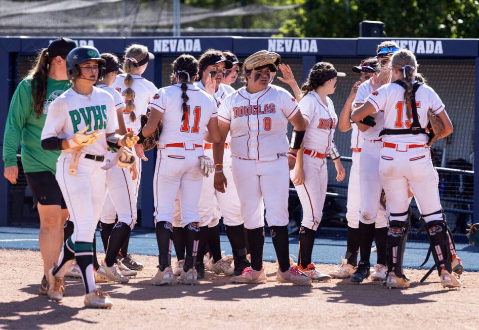 Douglas High players celebrate their 8-3 win against Palo Verde High during Class 5A softball s ...