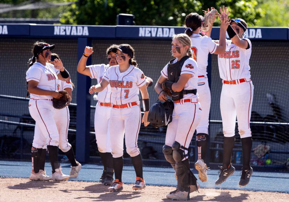 Douglas High players celebrate their 8-3 win against Palo Verde High during Class 5A softball s ...